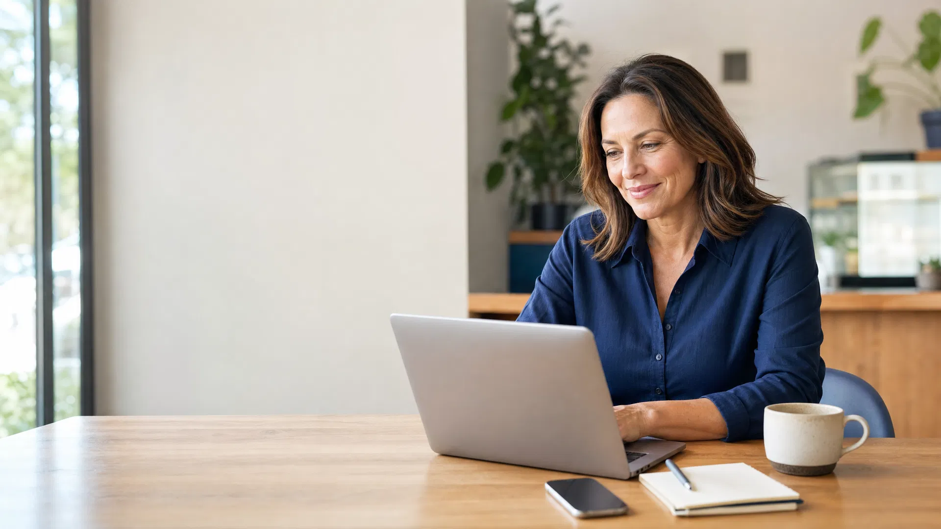 A small business owner reviewing her new website